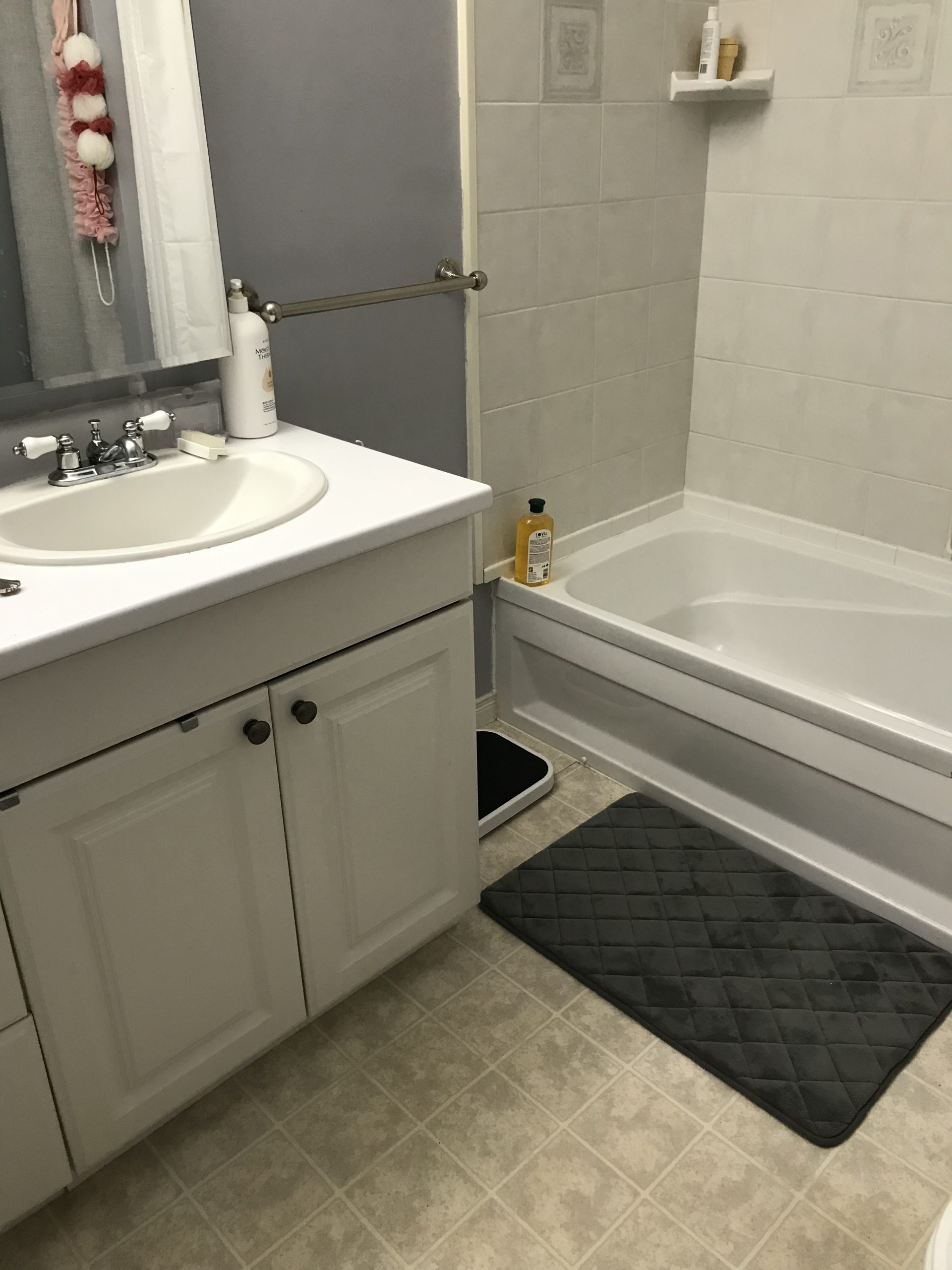 photo of bathtub and bathroom sink